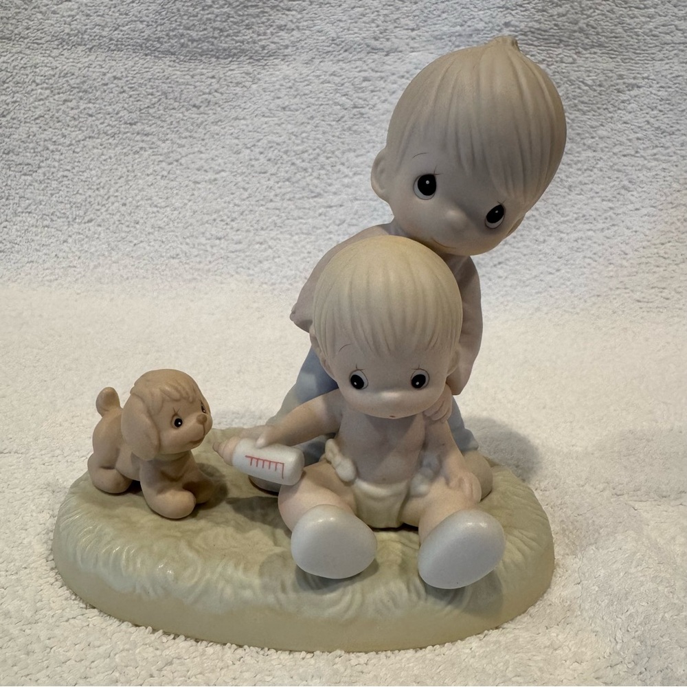 Precious Moments “Baby’s First Pet” figurine